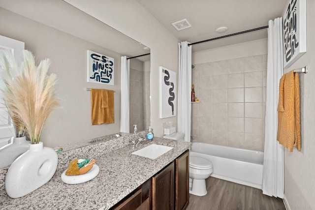 10637 Bleat St, Fort Worth, TX 76036 - full bathroom featuring toilet, vanity, wood finished floors, and shower / tub combo