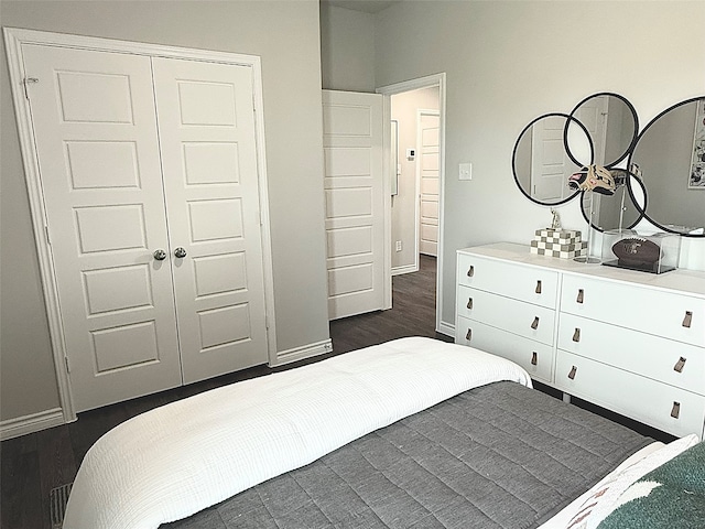 5056 Cervinae Rd, Fort Worth, TX 76036 - bedroom with a closet, dark wood-style floors, and baseboards
