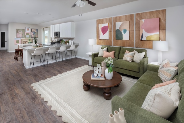 5056 Cervinae Rd, Fort Worth, TX 76036 - living area with dark wood-style floors, a ceiling fan, and baseboards