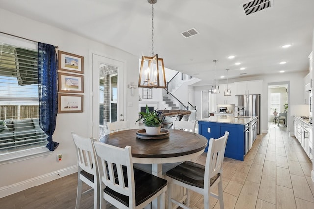 4529 Tolkien Ave, Celina, TX 76227 - dining room featuring stairway, light wood-style flooring, baseboards, recessed lighting, and a chandelier