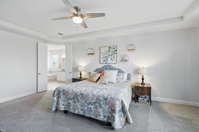 4529 Tolkien Ave, Celina, TX 76227 - bedroom with carpet, baseboards, a raised ceiling, ensuite bath, and a ceiling fan