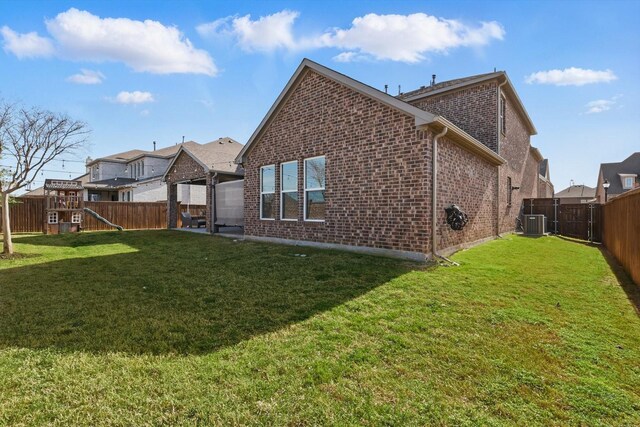 4529 Tolkien Ave, Celina, TX 76227 - rear view of property with brick siding and central AC unit