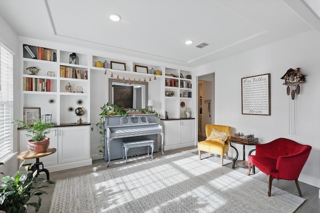 4529 Tolkien Ave, Celina, TX 76227 - living area featuring wood finished floors, built in shelves, and baseboards