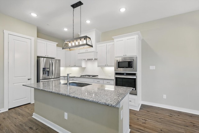 kitchen featuring a sink, appliances with stainless steel finishes, dark wood-style floors, and white cabinetry
