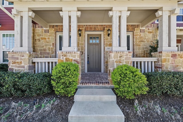 2757 S Market Sq, Northlake, TX 76247 - view of exterior entry featuring stone siding and a porch