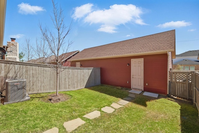 view of yard featuring cooling unit and a fenced backyard