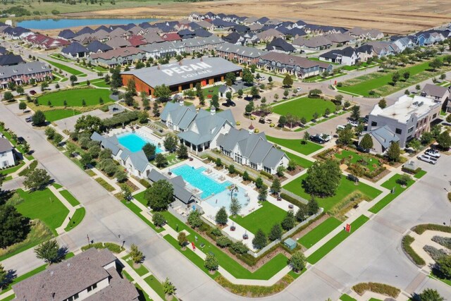 bird's eye view with a water view and a residential view