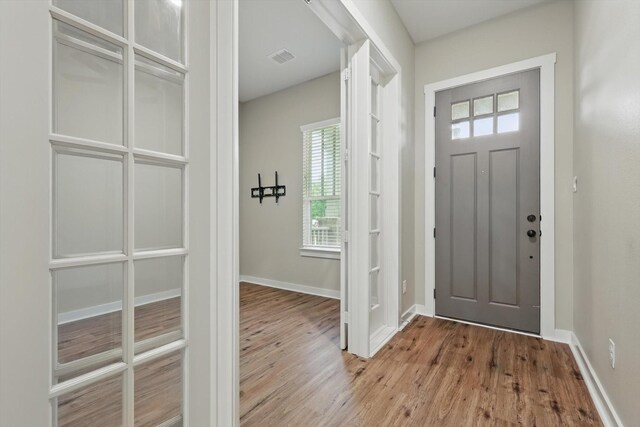 2757 S Market Sq, Northlake, TX 76247 - spare room with french doors, wood finished floors, and baseboards