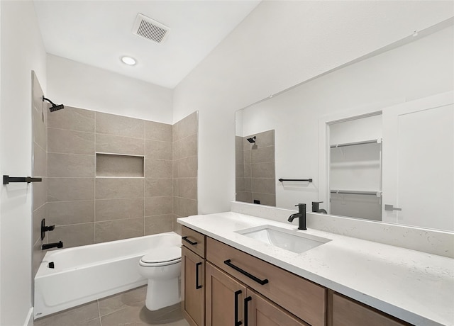 full bath with visible vents, toilet, vanity, and washtub / shower combination