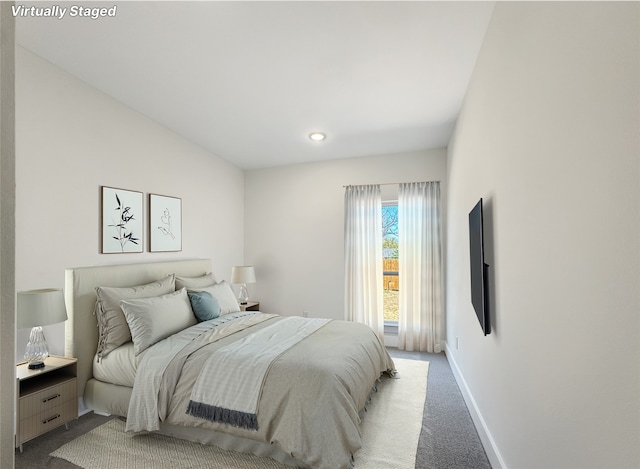 bedroom featuring light carpet, baseboards, and recessed lighting