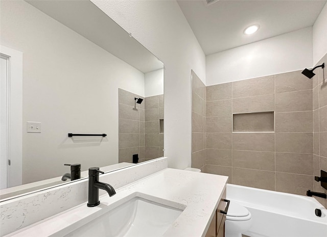 full bathroom featuring toilet, shower / bathing tub combination, and vanity