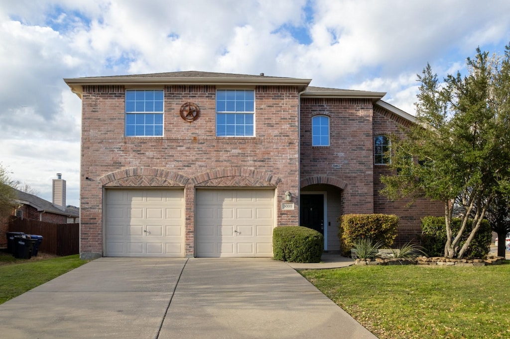 5000 Bald Cypress Ln, Mckinney, TX 75071 - traditional-style home with concrete driveway, brick siding, and an attached garage