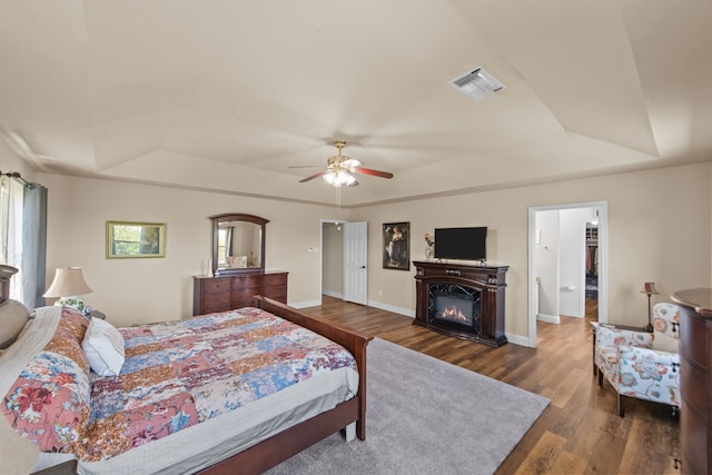 4167 Prairie Meadow Ct, Fort Worth, TX 76244 - bedroom featuring a raised ceiling, wood finished floors, and multiple windows