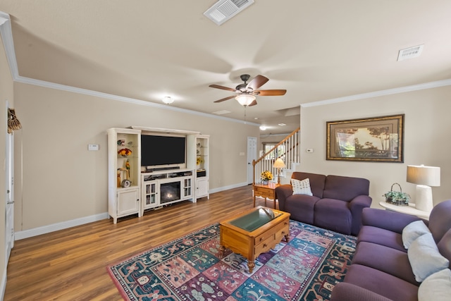 4167 Prairie Meadow Ct, Fort Worth, TX 76244 - living room with stairs, wood finished floors, baseboards, crown molding, and ceiling fan