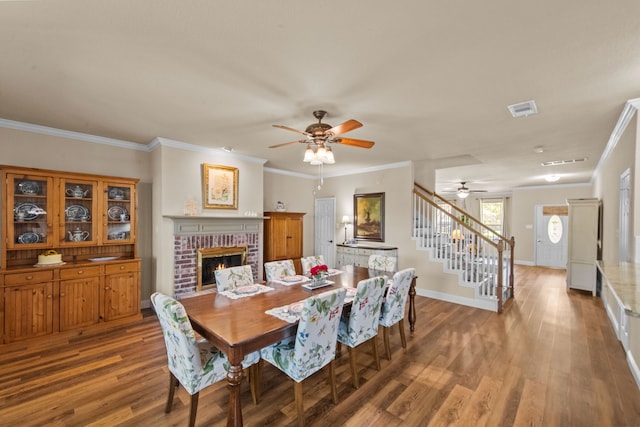 4167 Prairie Meadow Ct, Fort Worth, TX 76244 - dining room featuring ceiling fan, stairs, wood finished floors, baseboards, and a brick fireplace