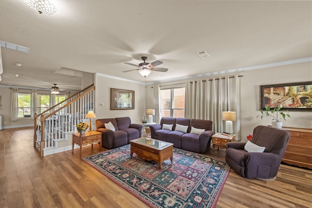 4167 Prairie Meadow Ct, Fort Worth, TX 76244 - living area featuring a ceiling fan, stairway, wood finished floors, ornamental molding, and baseboards