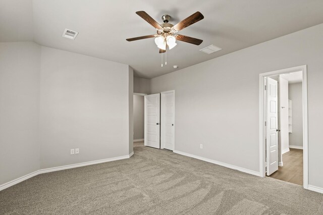 10569 Taruca Dr, Fort Worth, TX 76036 - unfurnished bedroom with carpet flooring, baseboards, lofted ceiling, and ceiling fan