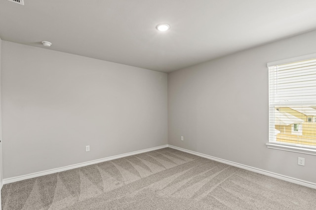 10569 Taruca Dr, Fort Worth, TX 76036 - unfurnished room featuring carpet flooring, baseboards, plenty of natural light, a smoke detector, and recessed lighting