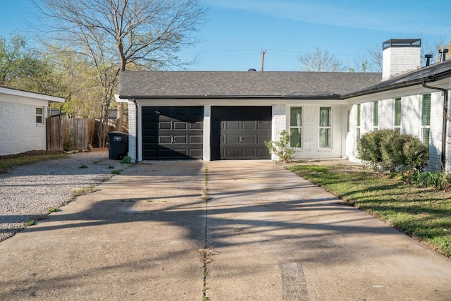 exterior space with driveway and fence