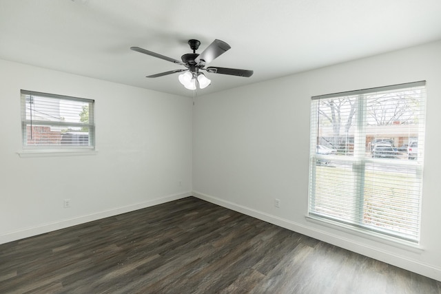 unfurnished room featuring baseboards, ceiling fan, and dark wood-style flooring