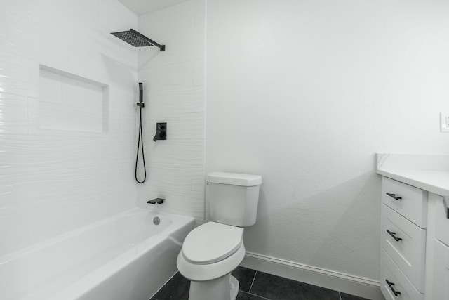 full bath with toilet, vanity, tub / shower combination, tile patterned flooring, and baseboards