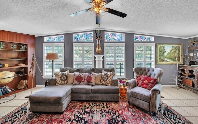 living area with a textured ceiling, baseboards, and tile patterned flooring
