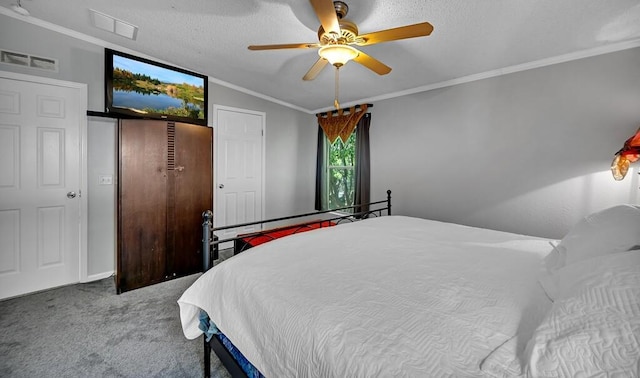 carpeted bedroom with crown molding, a textured ceiling, a ceiling fan, visible vents, and lofted ceiling