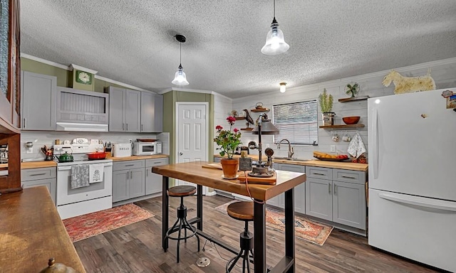 kitchen featuring crown molding, white appliances, open shelves, wood counters, and gray cabinetry