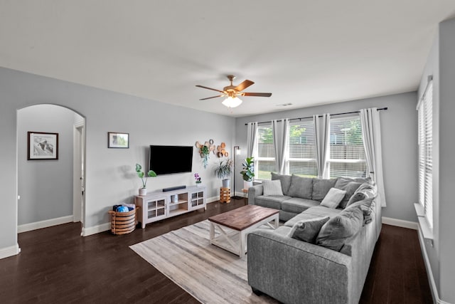11317 Denet Creek Ln, Fort Worth, TX 76108 - living room with arched walkways, wood finished floors, a ceiling fan, and baseboards