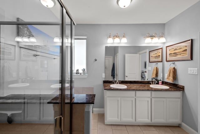 11317 Denet Creek Ln, Fort Worth, TX 76108 - bathroom with a shower stall, tile patterned floors, and a sink