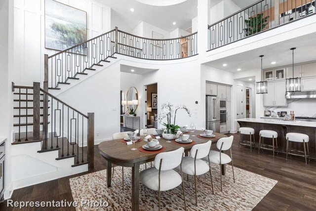 2352 Flora Dr, Mclendon Chisholm, TX 75032 - dining area featuring dark wood-style floors, stairway, a towering ceiling, and recessed lighting
