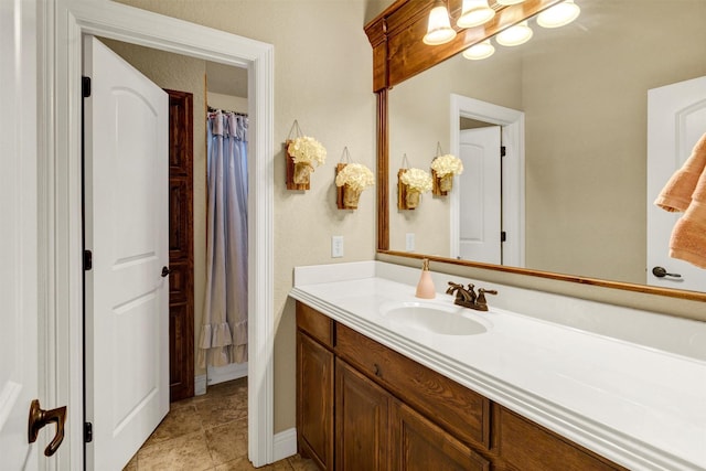 carpeted bedroom featuring baseboards, multiple windows, visible vents, and a raised ceiling