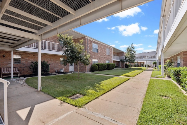 8511 Westover Ct Unit 217, Granbury, TX 76049 - view of home's community featuring a lawn