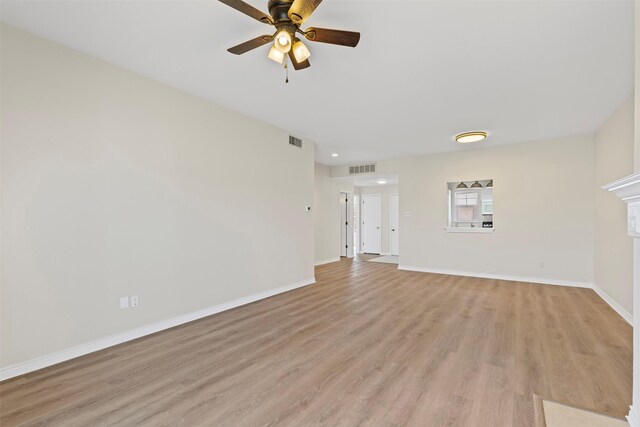 8511 Westover Ct Unit 217, Granbury, TX 76049 - unfurnished living room with ceiling fan, light wood-style floors, and baseboards