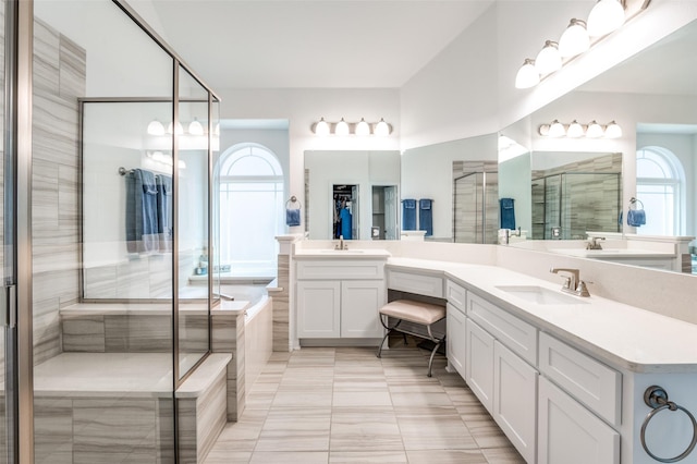 3721 Homeplace Dr, Celina, TX 75009 - bathroom with double vanity, a garden tub, a shower stall, and tile patterned flooring