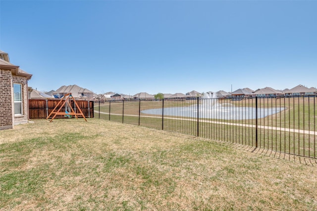 3721 Homeplace Dr, Celina, TX 75009 - fenced backyard with a playground, a residential view, and a water view