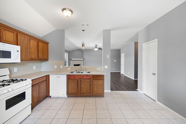 9304 Warren Dr, Mckinney, TX 75071 - kitchen featuring white appliances, light tile patterned flooring, a sink, visible vents, and brown cabinetry