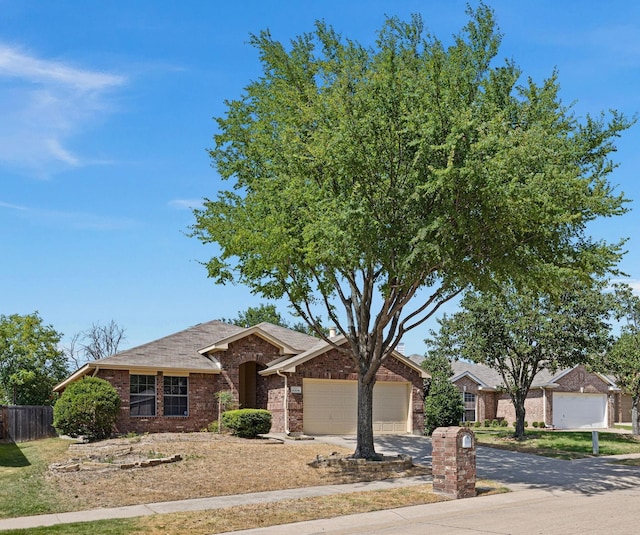 9304 Warren Dr, Mckinney, TX 75071 - single story home featuring fence, driveway, a garage, and brick siding