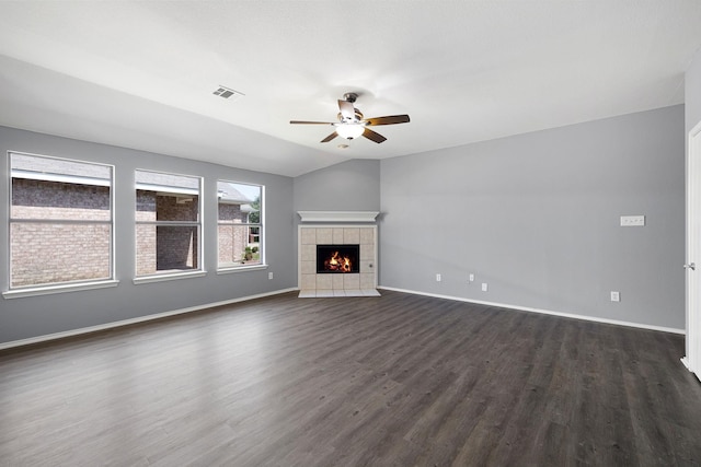 9304 Warren Dr, Mckinney, TX 75071 - unfurnished living room with visible vents, baseboards, ceiling fan, dark wood-type flooring, and vaulted ceiling