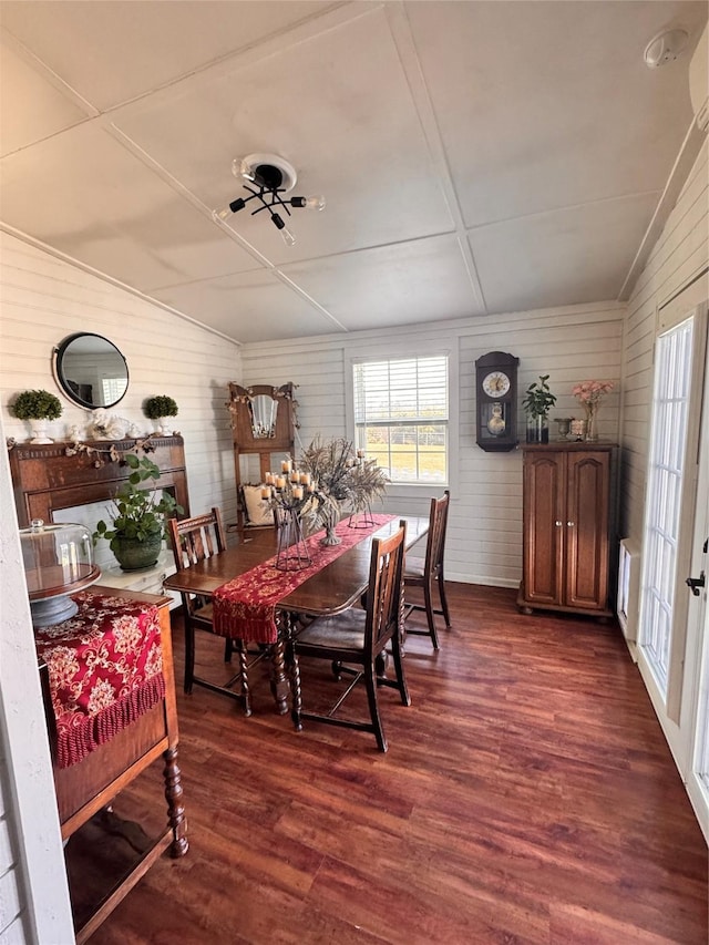 3163 Ranch Rd, Athens, TX 75751 - dining space with dark wood-style floors, lofted ceiling, and wooden walls