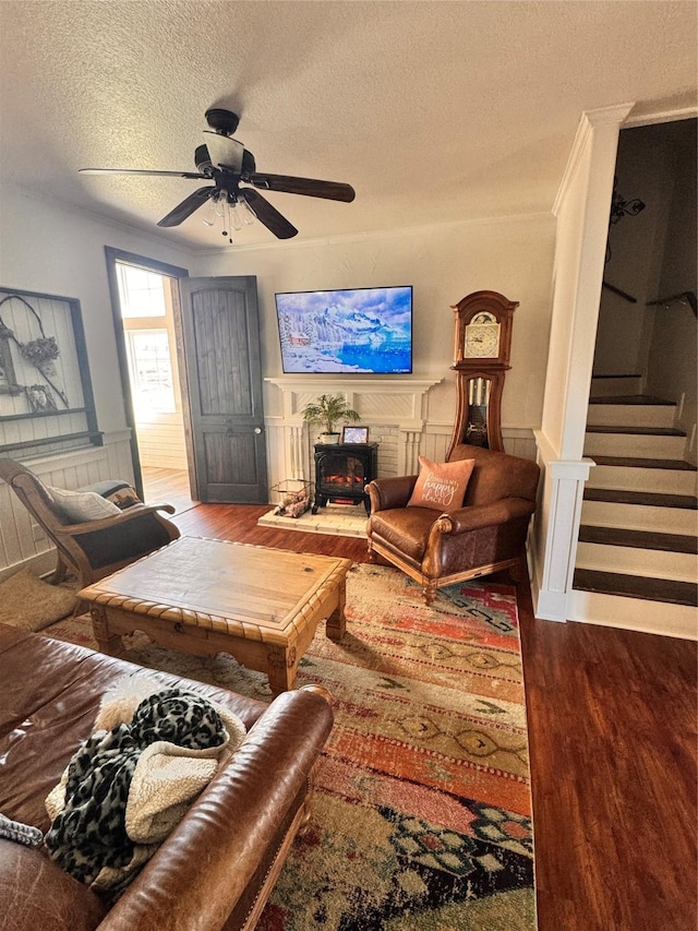 3163 Ranch Rd, Athens, TX 75751 - living area with wood finished floors, a textured ceiling, a ceiling fan, stairway, and ornamental molding