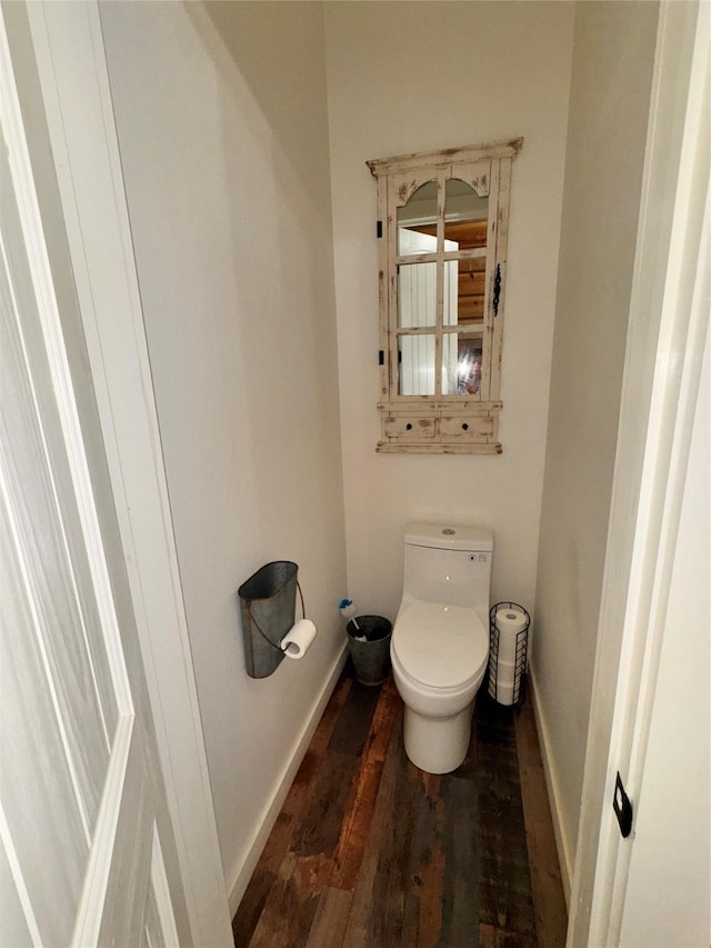 3163 Ranch Rd, Athens, TX 75751 - bathroom featuring wood finished floors, toilet, and baseboards