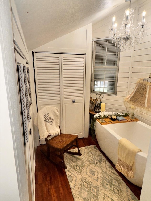 3163 Ranch Rd, Athens, TX 75751 - sitting room featuring vaulted ceiling, a chandelier, and wood finished floors