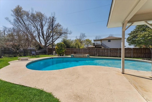 view of pool with a patio, a fenced backyard, and an in-ground hot tub