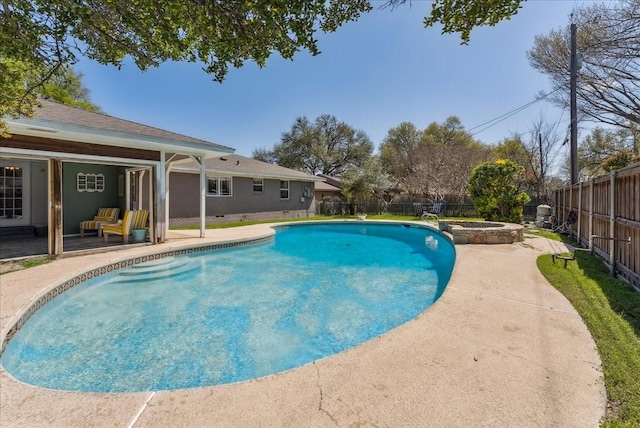 view of pool featuring a fenced backyard, a patio area, and a pool with connected hot tub