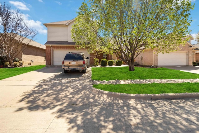 view of property hidden behind natural elements featuring brick siding, a front yard, an attached garage, and driveway