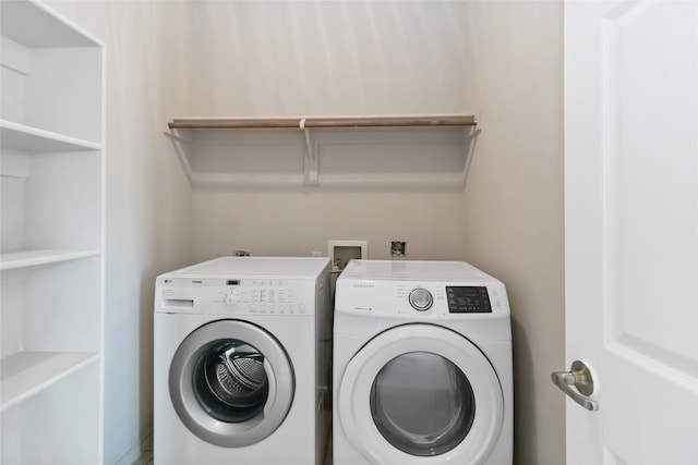 laundry area with separate washer and dryer and laundry area