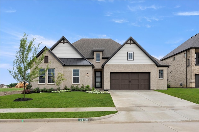 2109 Stratford Rd, Rockwall, TX 75087 - view of front of house featuring driveway, a front lawn, brick siding, and a shingled roof
