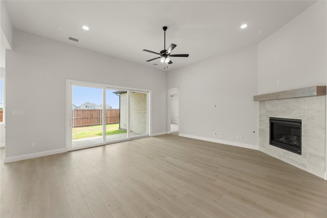 2109 Stratford Rd, Rockwall, TX 75087 - unfurnished living room with a ceiling fan, a fireplace, baseboards, light wood finished floors, and recessed lighting