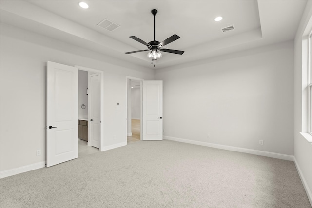 2109 Stratford Rd, Rockwall, TX 75087 - unfurnished bedroom featuring light colored carpet, baseboards, recessed lighting, and a tray ceiling